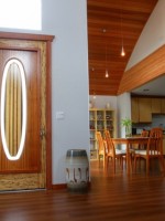 Great Room with surfboard and glass entry door